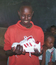 Gilson receiving his first pair of shoes